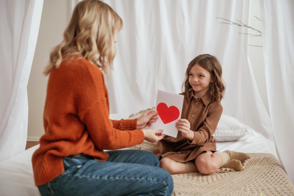 Love letter for mother's day, gift. Parent with daughter at home together